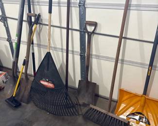 landscaping tools: rakes, brooms, shovels