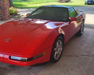 1994 Chevrolet Corvette Coupe 
5.7 L V8 LT1 Engine - 300 HP 
ONLY 19,XXX Original Miles 
Automatic Transmission
Torch Red w/ Tan Interior

The car has been garage kept with cover and the miles are original. It comes with two hard tops, one torch red and the other smoked glass. Extras include ZR1 wheels, Larger Tires, Borla Exhaust, Front Brake Cooling Ducts, and Aftermarket Radio.