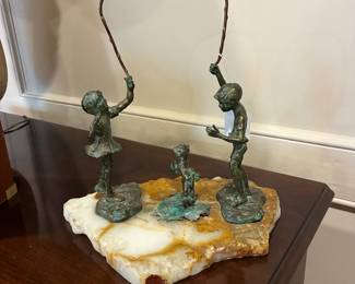 Bronze children playing on Marble base
