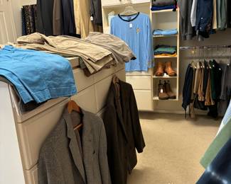 Huge closet filled with clothes  men and ladies in other rooms  also have young girls 