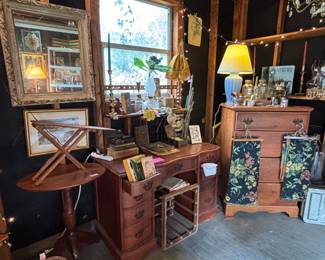 Great vintage books and odd pieces. Love that mirror…