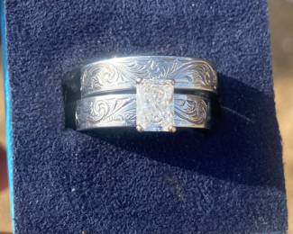 Stainless steel, custome made, hand engraved. One of a kind set radiant cut, 0.80 ct J color SI2 Excellent cut. 
15 yrs ago diamond was $5,000. Have appraisal. $1,500