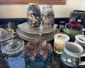 Jars of buttons, reamers, and mugs
