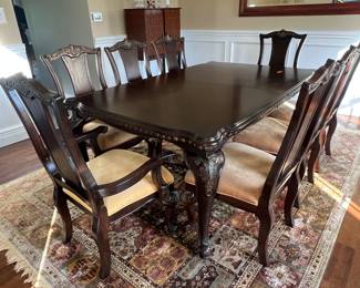 Dining room table and chairs and 8 x 11 rug