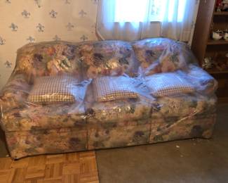 Floral couch wrapped up. Matching Loveseat next