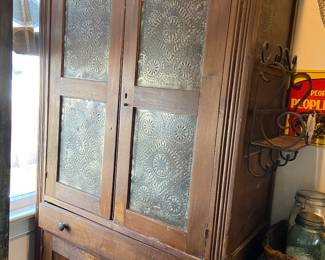Vintage tin front pie safe in the Pantry