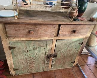 Rustic distressed wooden cabinet in kitchen