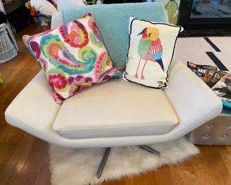 One of a pair of swivel chairs on chrome base by Avenue Six, Living Room