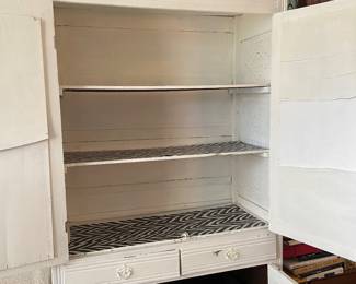 Inside of painted wooden cabinet in Bedroom #1