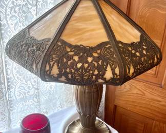 This amazing antique lamp is heavy! It is in AS IS condition as it has 2 broken panels. 