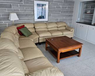 Leather sectional couch and oak coffee table