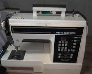 White portable computer sewing machine
