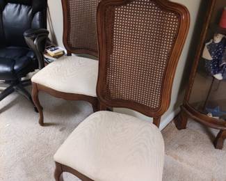 Two more cane back chairs that match the dining room chairs...
