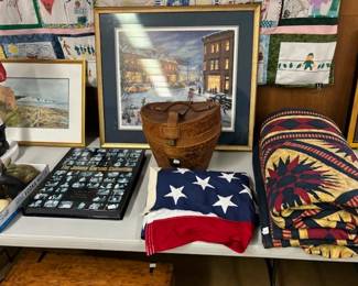 assorted items including an oversized American flag, an early starburst quilt, signed Johnny Carson VHS collection, art