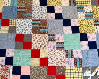 (Quilt laid out)