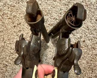 Item #69/Item #70 1950s Hudley Texan Cast Iron Cap Gun - sold seperately Item #69 $40 (gun on left) Item #70 $60 (gun on right)