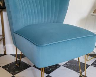 A pair of these modern Blue Chairs.