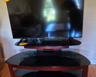 50" Fire TV Sitting on 3 Glass Black Shelf Stand