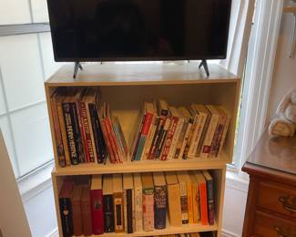 Books, shelving units, TV