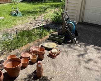 More pots. Hose caddy. Wheel Barrow