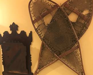Victorian magazine rack next to a pair of snowshoes!