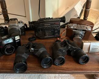 Binoculars, Cameras and Palmcorder.