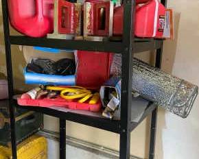 Metal Shelf With Gas Cans Other Automotive Necessities