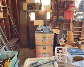 Tool cabinet, lumber, bricks, gas cans, car accessories