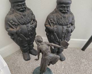 vintage cast Iron andirons and a brass figurine