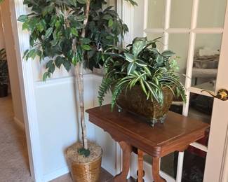antique table and silk plants