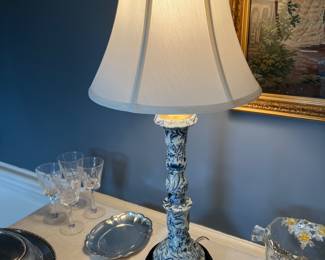 One of a pair of antique blue and white based lamps