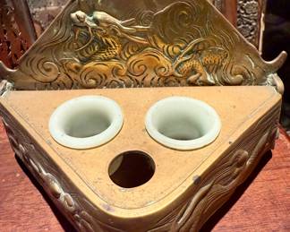 A Japanese bronzed and gilt scribe's box, hinged cover pierced and cast with a dragon at the base of a mountain…circa 1900.