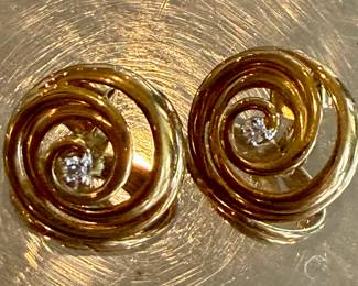 Large gold swirl earrings with diamonds