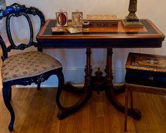 Victorian walnut game table with ebony inlay.