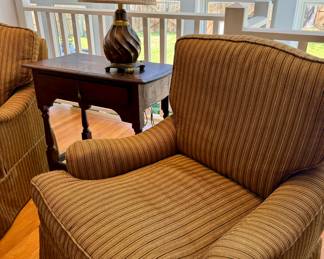 Pair of custom club chairs in gold and dark green.