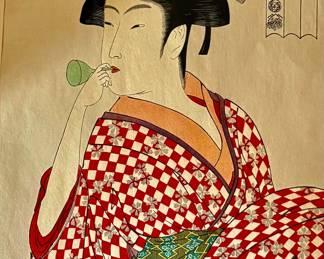 A woodblock print titled "Young Woman Blowing a Poppin" by Japanese artist Kitagawa Utamaro, created around 1790!