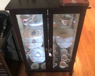 Cute cabinet with light and its filled with coronation plates, teacup sets and mugs!