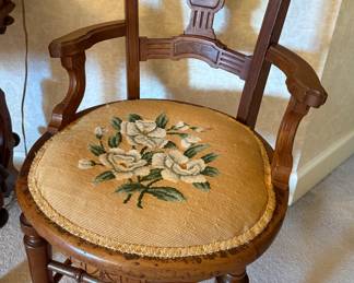 Antique desk chair with needlepoint cushion