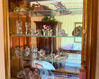 Mirrored glass display case with crystal miniature figurines