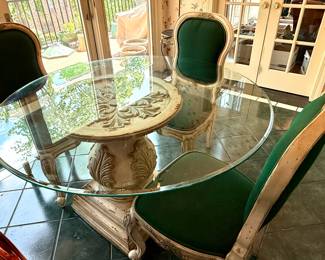 Round glass top pedestal table with 4 antique white green upholstered chairs