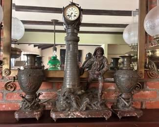 ZOLD!! Garniture Set. Lighthouse clock with pair of side urns. Claudius (1844-1919): “Hardy! Courage!". Lighthouse clock in patinated regula on a marble base, made by Claudius. A rescuer holding a buoy is stationed on the terrace of an imposing clock lighthouse.
Artist: Claudius (1844-1919)
Period: 19th century
Condition: Excelllent
Material: Gilt bronze
Width: 35,5 cm
Height: 71 cm
Depth: 25
