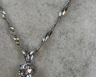 #179 - $600 - 14kt white twisted chain 18"L with 0.38 diamond solitaire. 21 gr.