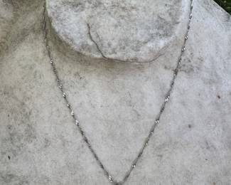 #179 - $600 - 14kt white twisted chain 18"L with 0.38 diamond solitaire. 21 gr.