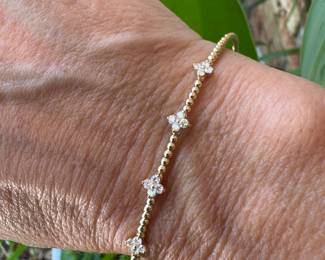 #175- $575.- 0.41ctw diamond clover bracelet 14kt gold 5.0gr- sz 8.5