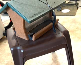 Birdhouse and plastic tables 