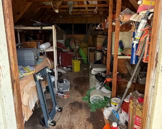 The larger tan shed was used to store lawn tools and chemicals.