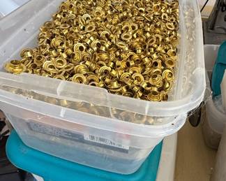 Bins of brass grommets