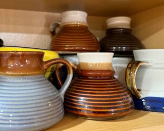Pottery tipsy mugs