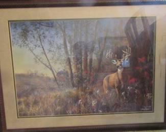 Large print of a buck deer in the woods, nicely framed.