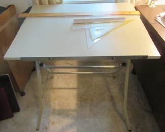 Small draftsman table with some equipment.